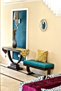 Beautiful light blue wallpaper detail, wall fixture in the lobby entrance